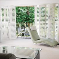 bi fold tracked plantation shutters fitted to external french door