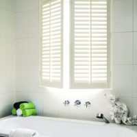full height window shutters in the bathroom